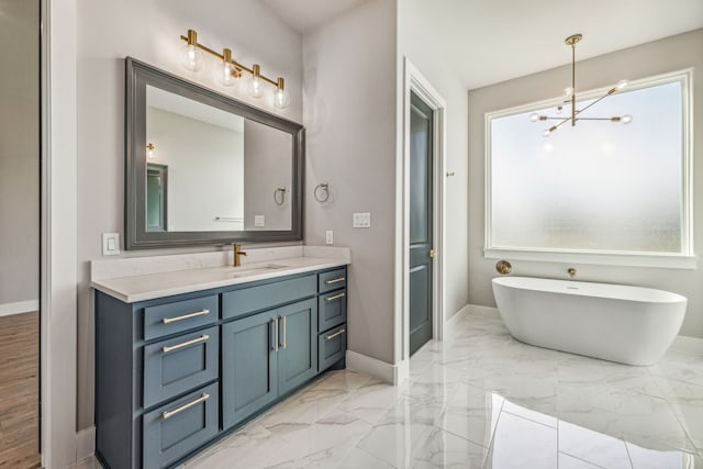 bathroom featuring tile patterned flooring, vanity, and an inviting chandelier