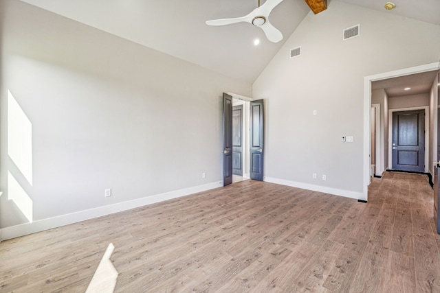 unfurnished bedroom with high vaulted ceiling, ceiling fan, beamed ceiling, and light hardwood / wood-style flooring