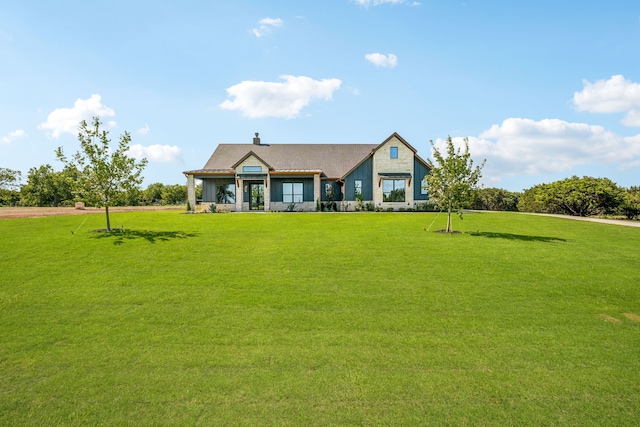 view of front of home with a front yard