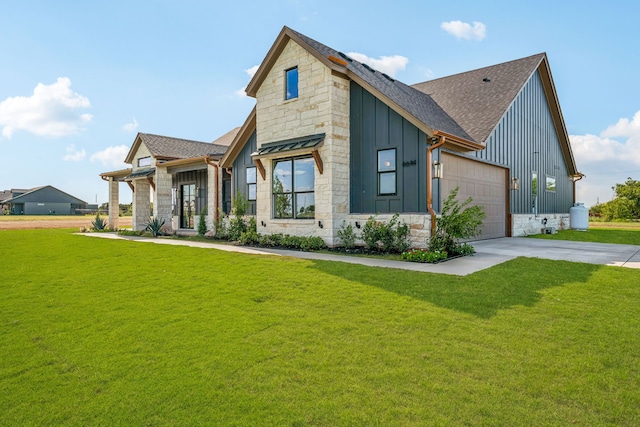 view of front facade with a garage and a front lawn