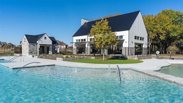 view of pool featuring pool water feature