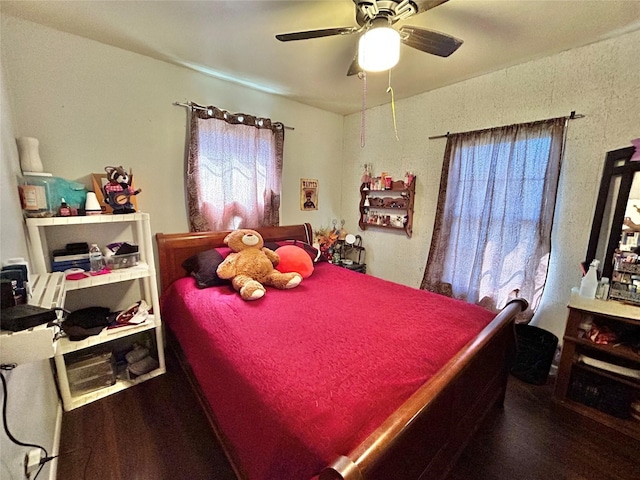 bedroom featuring hardwood / wood-style flooring and ceiling fan