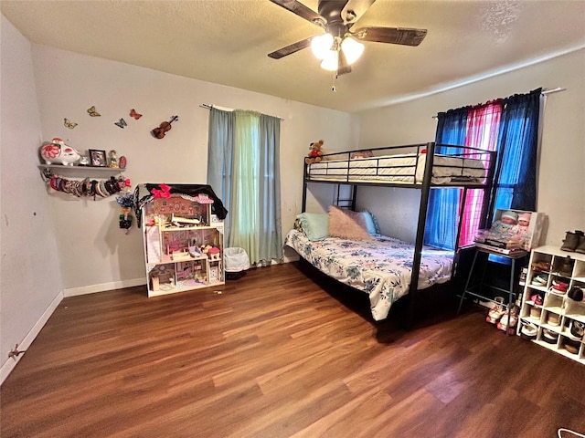 bedroom featuring a textured ceiling, ceiling fan, and hardwood / wood-style floors