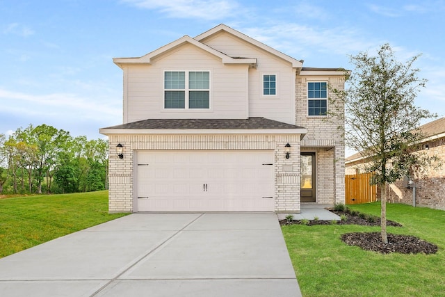 view of property with a garage and a front lawn