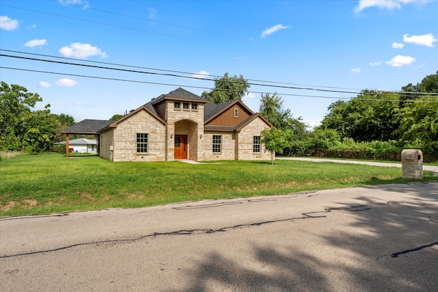 view of front of property with a front lawn