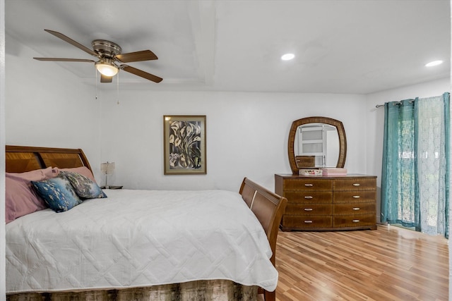 bedroom with light hardwood / wood-style floors and ceiling fan