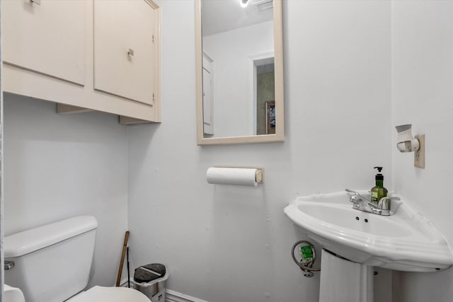 bathroom with sink and toilet