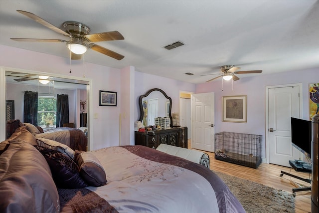 bedroom featuring ceiling fan and light wood-type flooring