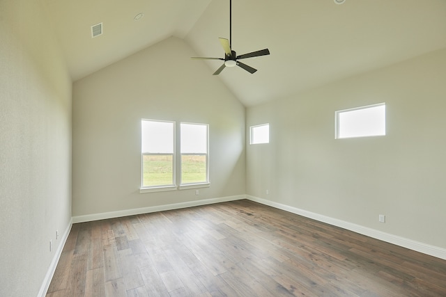 spare room featuring hardwood / wood-style flooring, ceiling fan, a healthy amount of sunlight, and high vaulted ceiling