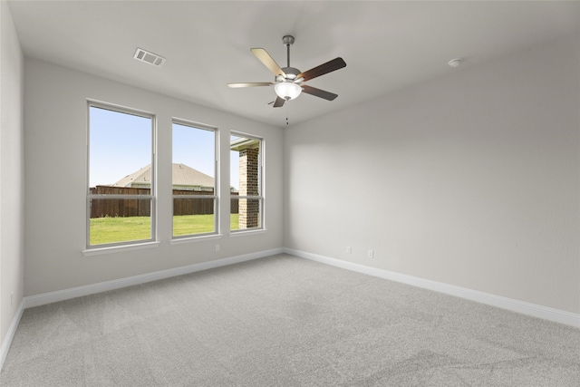 empty room featuring carpet and ceiling fan