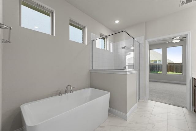 bathroom with vanity, plus walk in shower, and ceiling fan