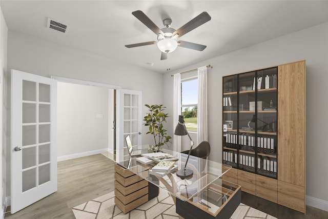 office featuring french doors, ceiling fan, and wood-type flooring