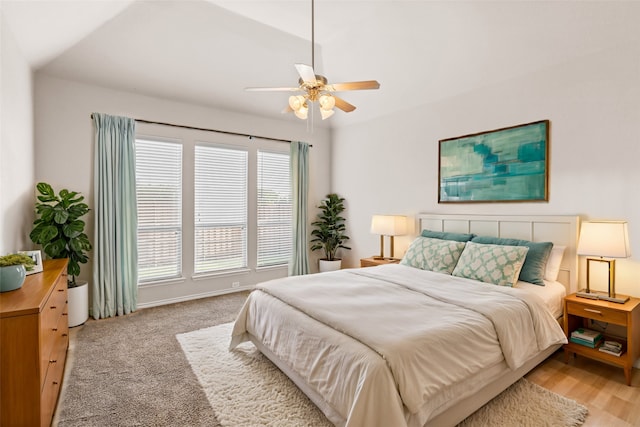 bedroom featuring lofted ceiling, ceiling fan, and light hardwood / wood-style floors