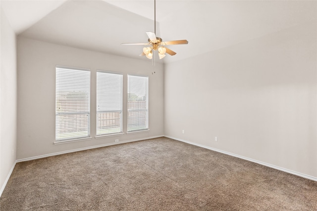 spare room with light carpet, lofted ceiling, and ceiling fan