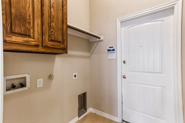 laundry room featuring washer hookup, cabinets, light tile patterned floors, and electric dryer hookup