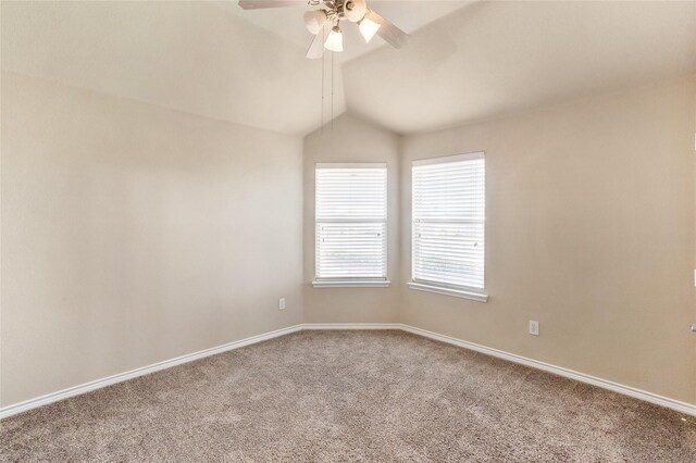 spare room featuring vaulted ceiling, ceiling fan, and carpet