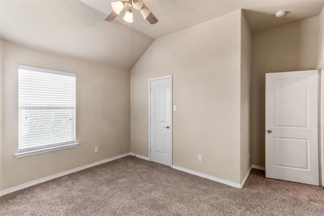 unfurnished bedroom with vaulted ceiling, ceiling fan, and carpet flooring