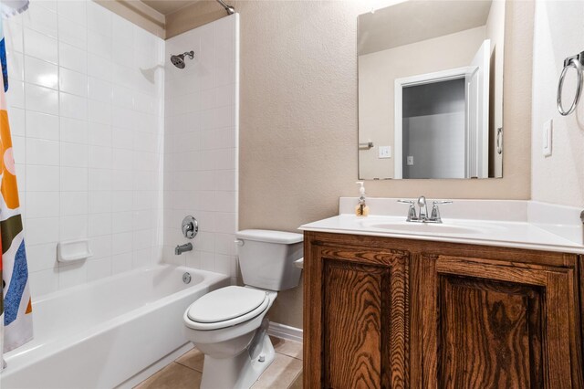 full bathroom featuring tile patterned flooring, toilet, shower / tub combo, and vanity