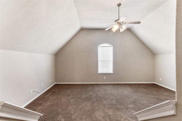 additional living space featuring lofted ceiling, ceiling fan, carpet floors, and a textured ceiling