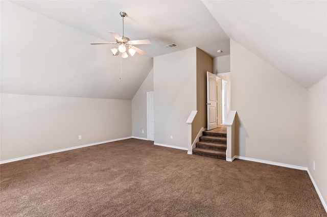 additional living space with ceiling fan, carpet floors, and vaulted ceiling