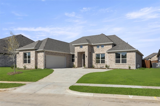 view of front facade with a front yard, cooling unit, and a garage