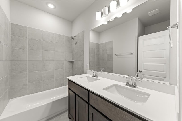 bathroom featuring vanity and tiled shower / bath combo