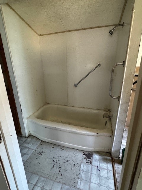 bathroom with tile patterned flooring and shower / washtub combination