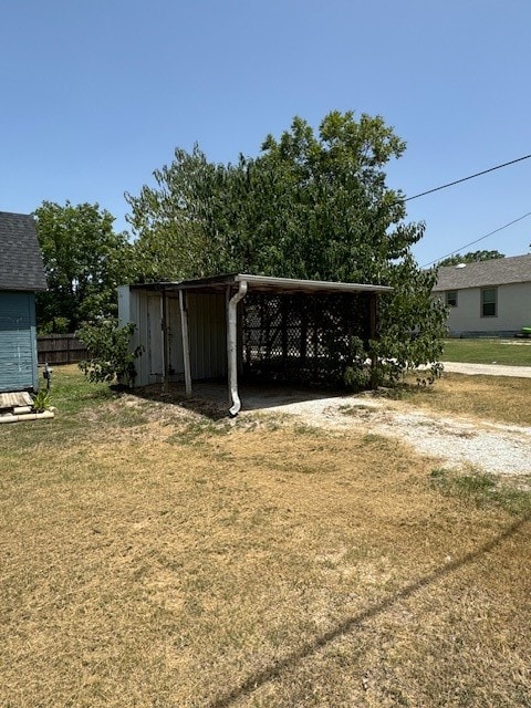 exterior space featuring a shed and a carport