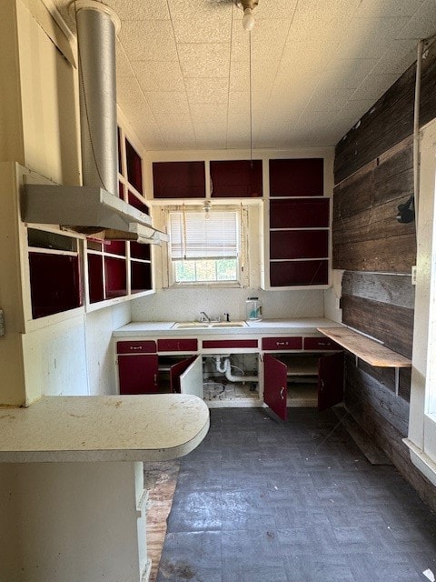 kitchen with sink and dark tile patterned floors