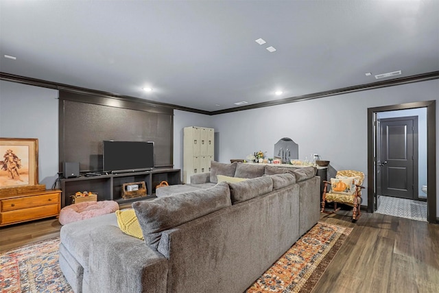 living room with ornamental molding and dark wood-type flooring