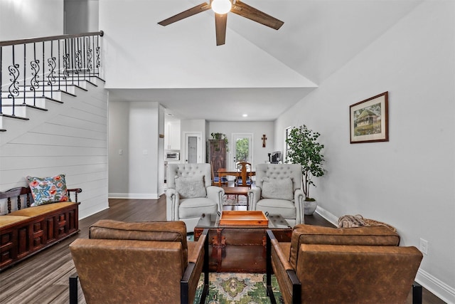 living room with ceiling fan, wood-type flooring, and high vaulted ceiling