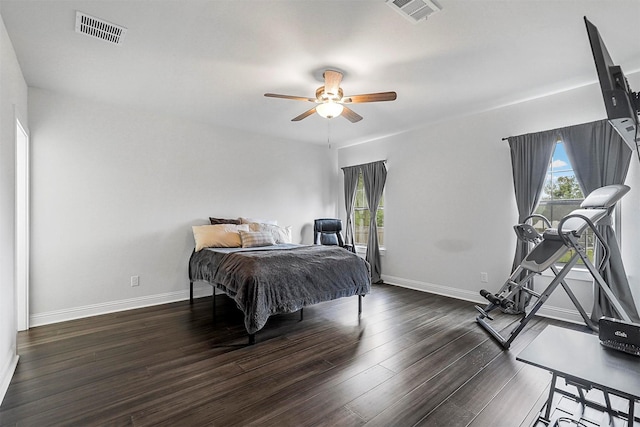 bedroom with dark hardwood / wood-style floors and ceiling fan