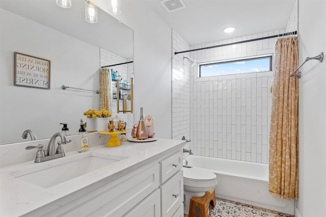 full bathroom with vanity, toilet, and shower / bath combo