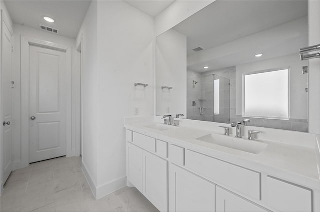 bathroom featuring vanity and a shower with shower door