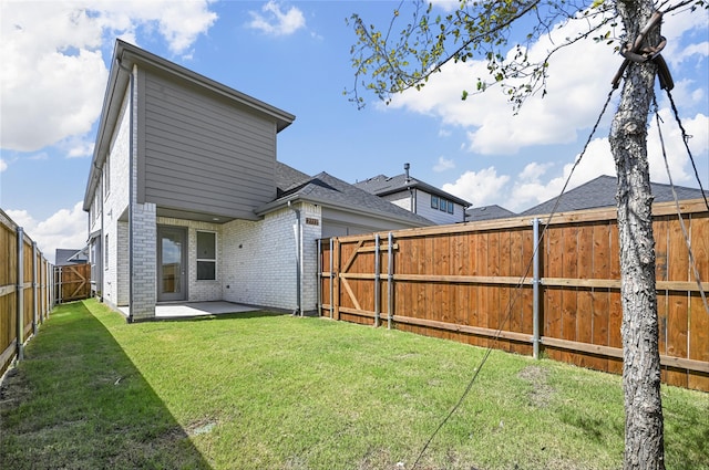 exterior space with a yard and a patio area