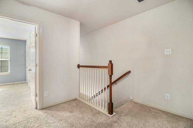 stairway with carpet floors