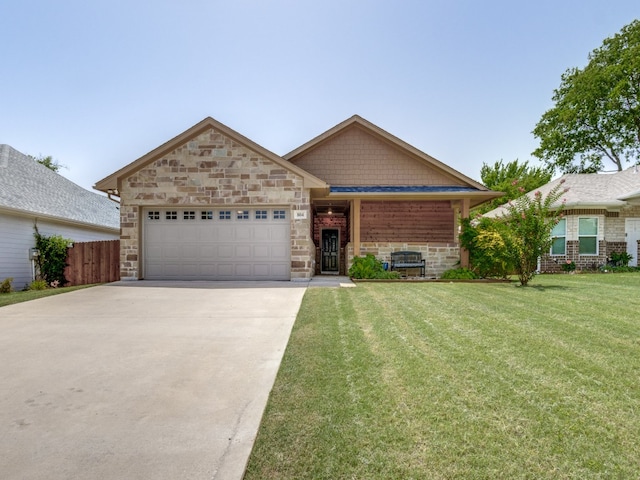 view of front facade featuring a garage and a front yard