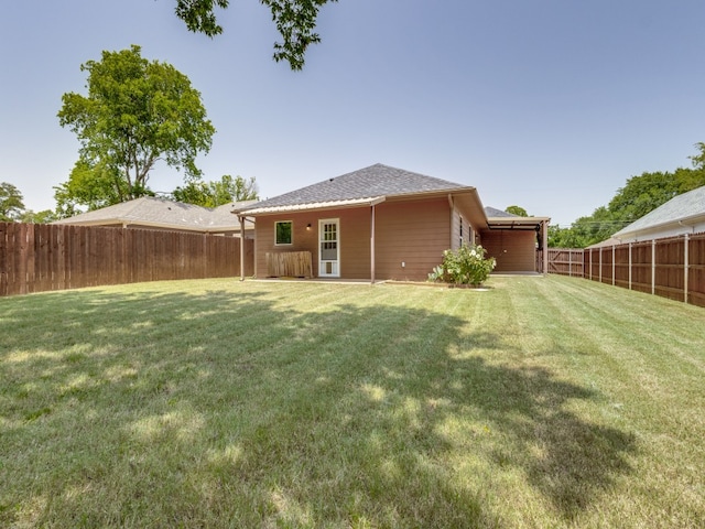 rear view of house with a yard