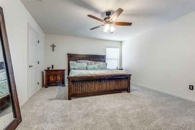 bedroom featuring light colored carpet and ceiling fan