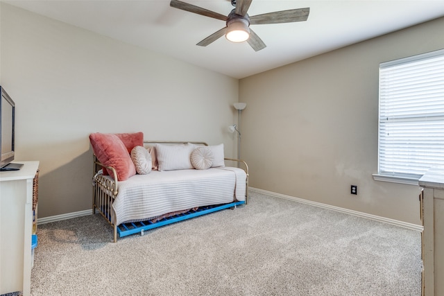 carpeted bedroom featuring ceiling fan