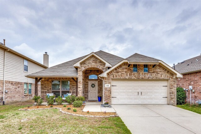 view of front facade featuring a porch and a garage