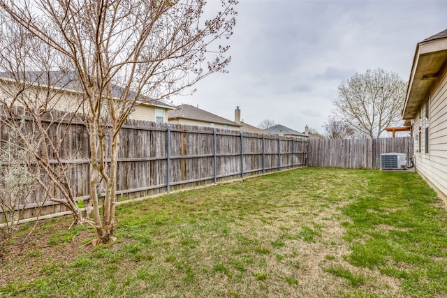 view of yard with central AC unit