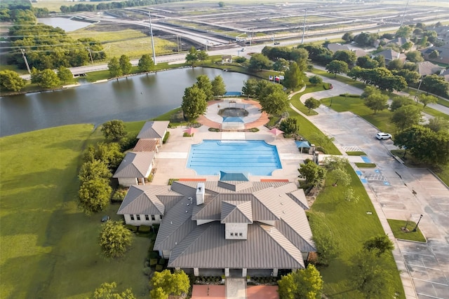 birds eye view of property with a water view