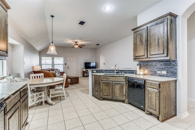 kitchen featuring dishwasher, backsplash, sink, hanging light fixtures, and ceiling fan