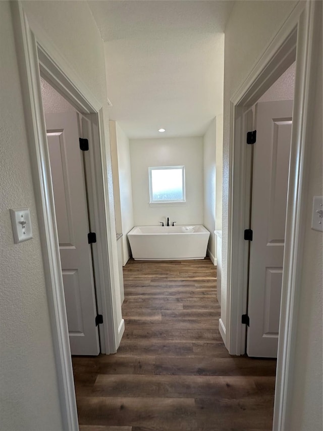 corridor with dark wood-type flooring