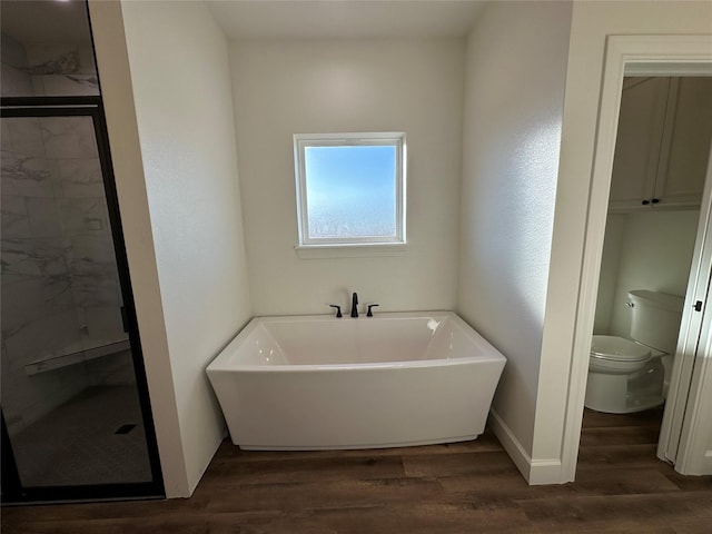 bathroom featuring hardwood / wood-style floors, independent shower and bath, and toilet