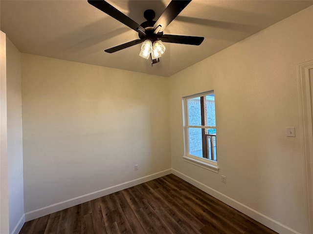 empty room with ceiling fan and dark wood-type flooring