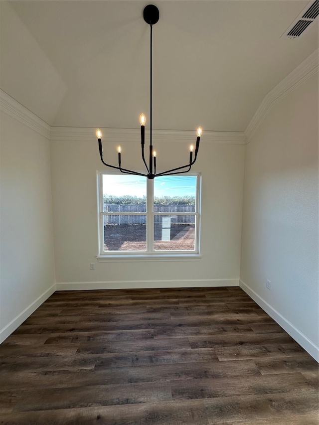 unfurnished dining area featuring dark hardwood / wood-style flooring, ornamental molding, vaulted ceiling, and an inviting chandelier