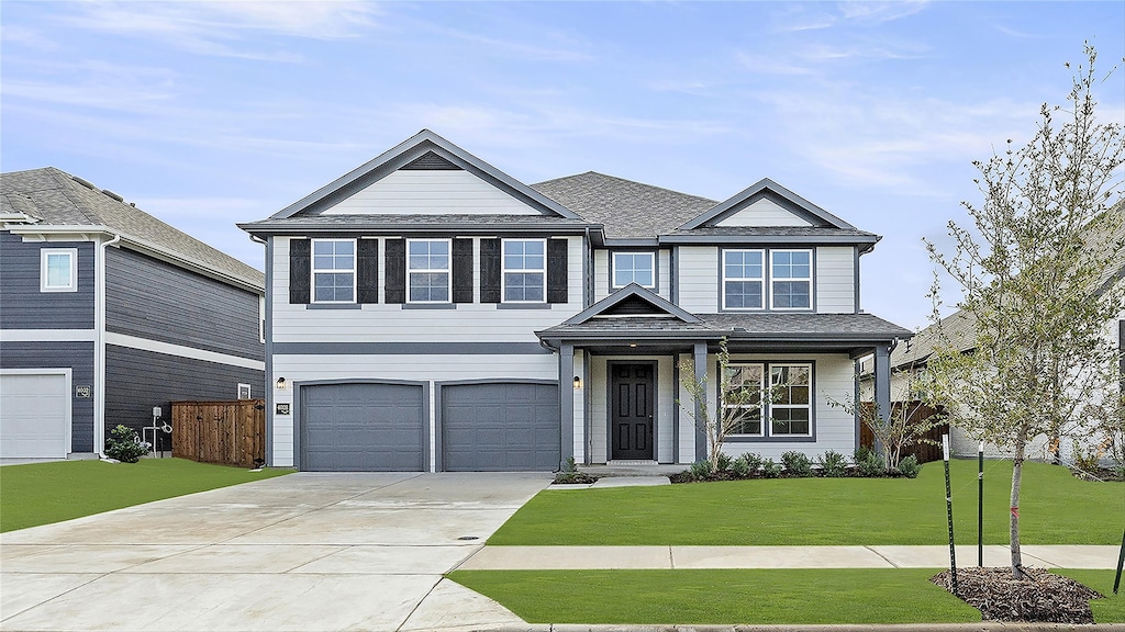 view of front facade featuring a garage and a front yard