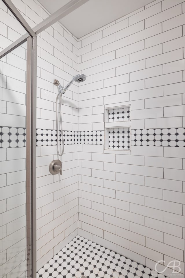 bathroom featuring an enclosed shower